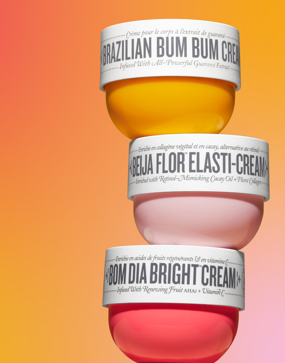 three different Sol De Janeiro containers of cream stacked atop one another